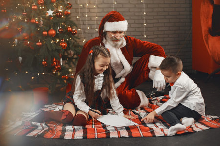 A cute children writes a letter to Santa Clausの写真素材