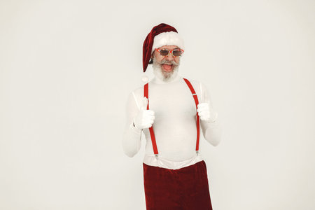 Modern santa claus in sunglasses on a white background