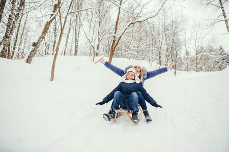 Mother with cute son in a winter oark