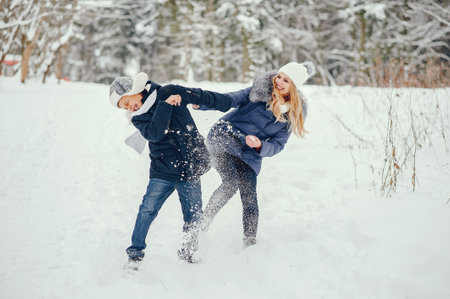 Mother with cute son in a winter oarkの写真素材