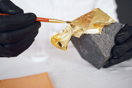 Man in a white shirt works with a cementの写真素材