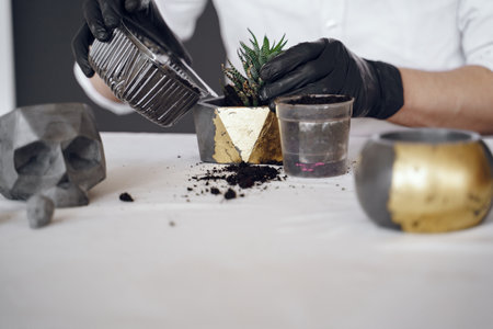 Man in a white shirt works with a cementの写真素材