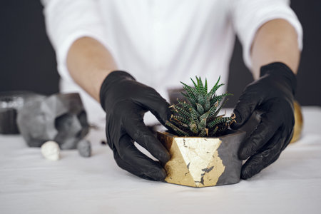 Man in a white shirt works with a cement