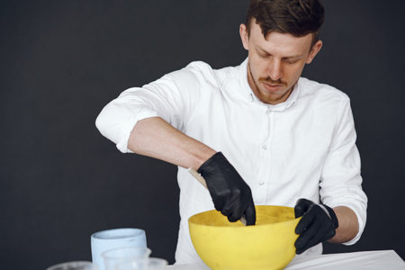 Man in a white shirt works with a cement
