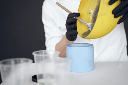 Man in a white shirt works with a cement