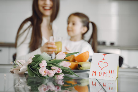 Mother with daughter at homeの写真素材