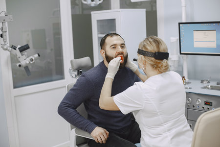 Otolaryngologist preparing for the medical examination procedureの写真素材