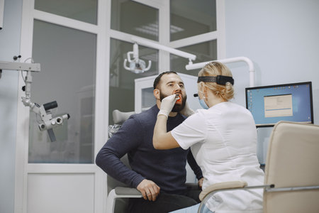 Otolaryngologist preparing for the medical examination procedureの写真素材