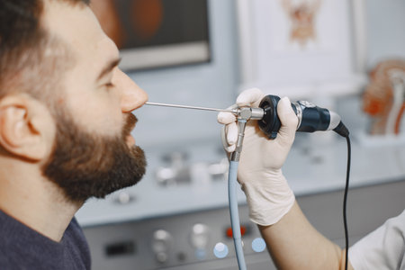 Doctor talking to her male patient at officeの写真素材