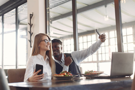 Stylish people working in a office and use the laptop