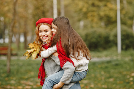 Cute and stylish family in a autumn parkの写真素材