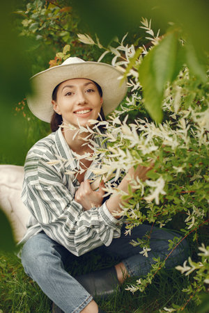 Stylish woman spending time in a spring parkの写真素材