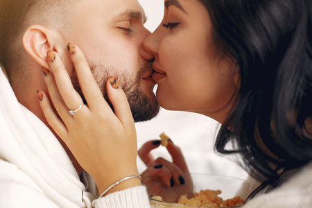 Beautiful couple spend time in a bedroom