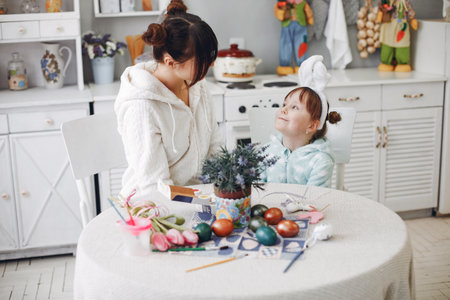 Mother with little daughter in a kitchenの写真素材