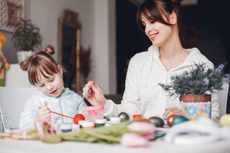 Mother with little daughter in a kitchenの写真素材
