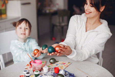 Mother with little daughter in a kitchenの写真素材