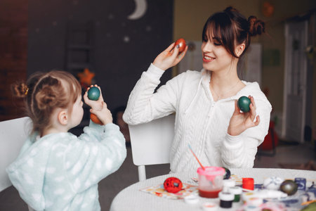 Mother with little daughter in a kitchen
