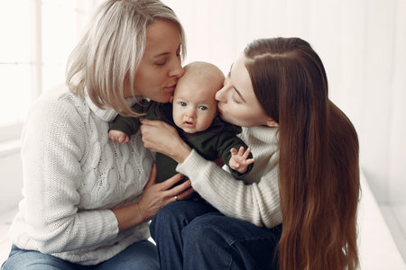 Elegant grandma at home with daughter and granddaughter