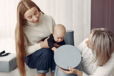 Elegant grandma at home with daughter and granddaughter