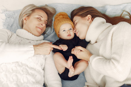 Elegant grandma at home with daughter and grandson