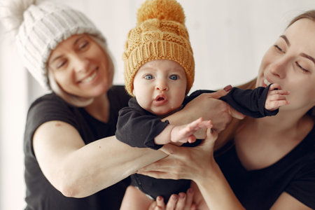 Elegant grandma at home with daughter and grandson