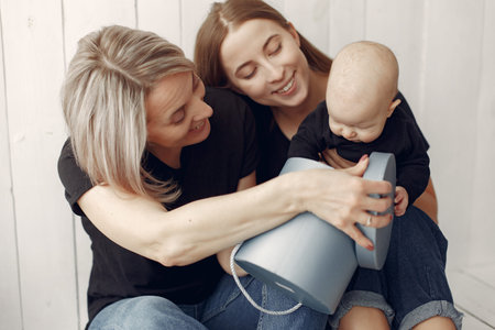 Elegant grandma at home with daughter and grandson