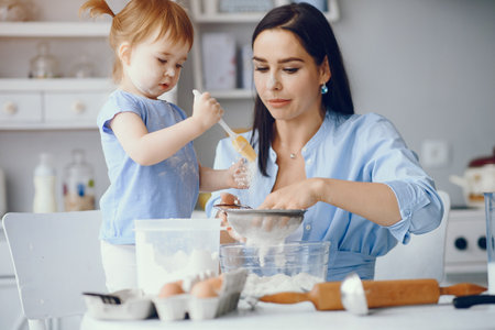 Cute family prepare the breakfest in a kitchenの写真素材