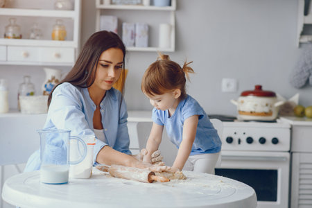 Cute family prepare the breakfest in a kitchenの写真素材