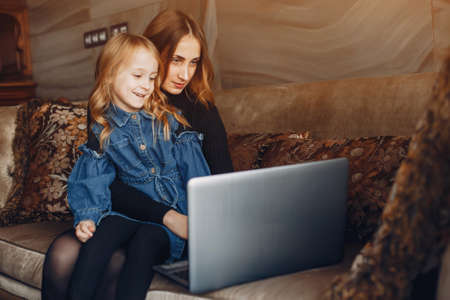 Beautiful mother with a little daughterの写真素材