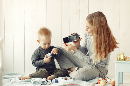 Mother with son at home prepare to easterの写真素材