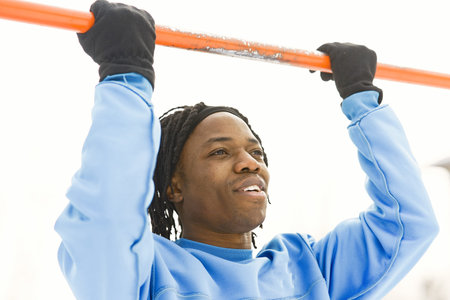 African american man doing exercise on winter day