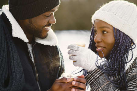 African american couple in a winter forestの写真素材