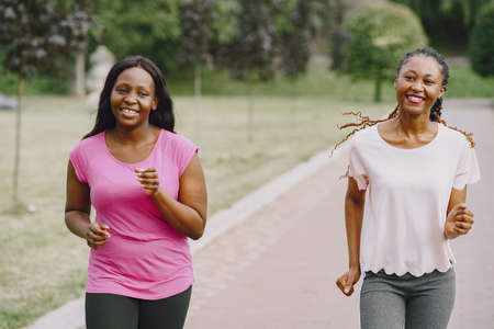 African american women having workout in park in sportswearの写真素材
