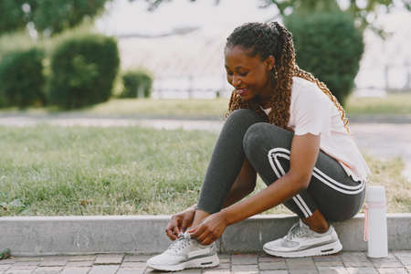 African american woman having workout in park in sportswearの写真素材