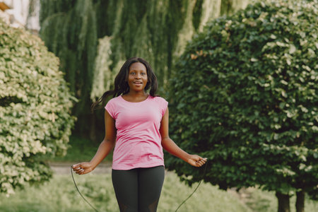 African american woman having workout in park in sportswearの写真素材