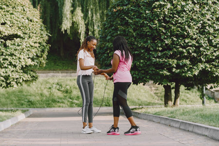 African american women having workout in park in sportswearの写真素材