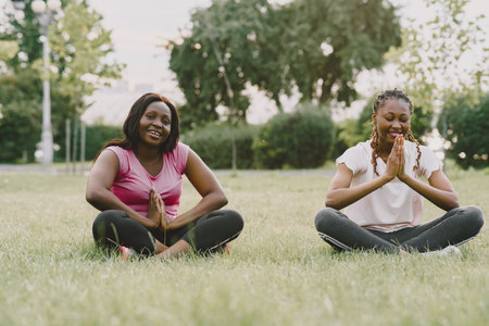 African american women having workout in park in sportswearの写真素材
