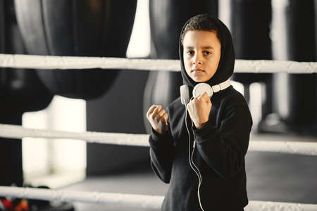 Little boy in a headphoneson ringの写真素材