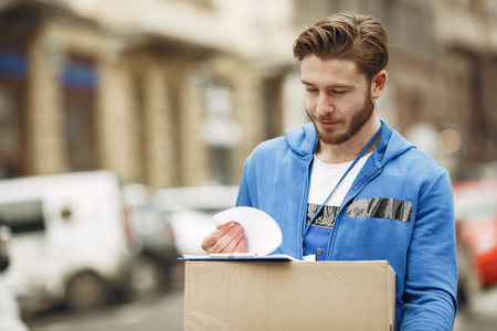 Delivery man with package outdoors