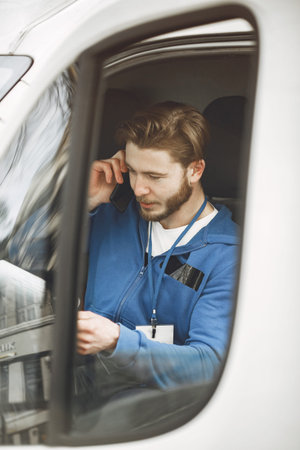Delivery man with package outdoors