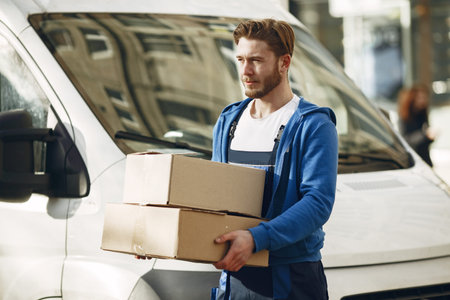 Delivery man with package outdoors