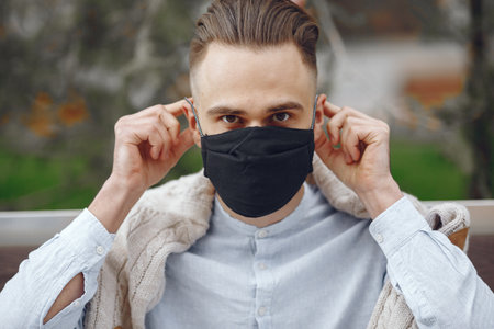 Young businessman in a summer cityの写真素材