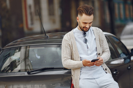Young businessman in a summer city