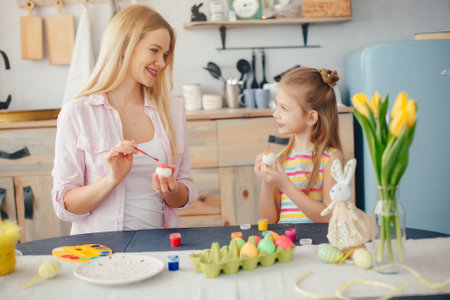 Mother with little daughter in a kitchenの写真素材