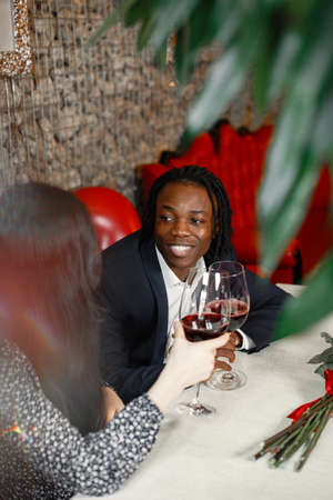 Romantic dinner in a restaurant with wine and delicious foodの写真素材