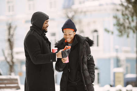 African american couple in a winter cityの写真素材