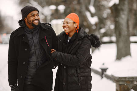 African american couple in a winter cityの写真素材