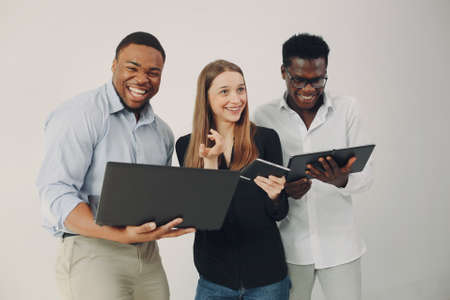 Young international people working together and use the laptopの写真素材