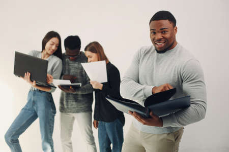 Young international people working together and use the laptopの写真素材