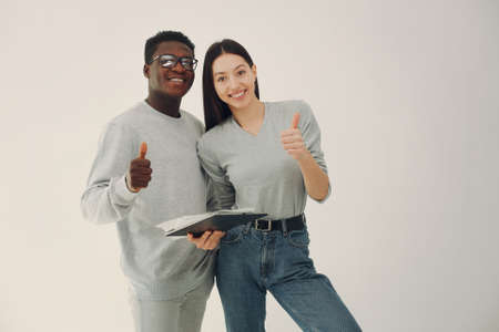 Young international couple working together and use tabletの写真素材